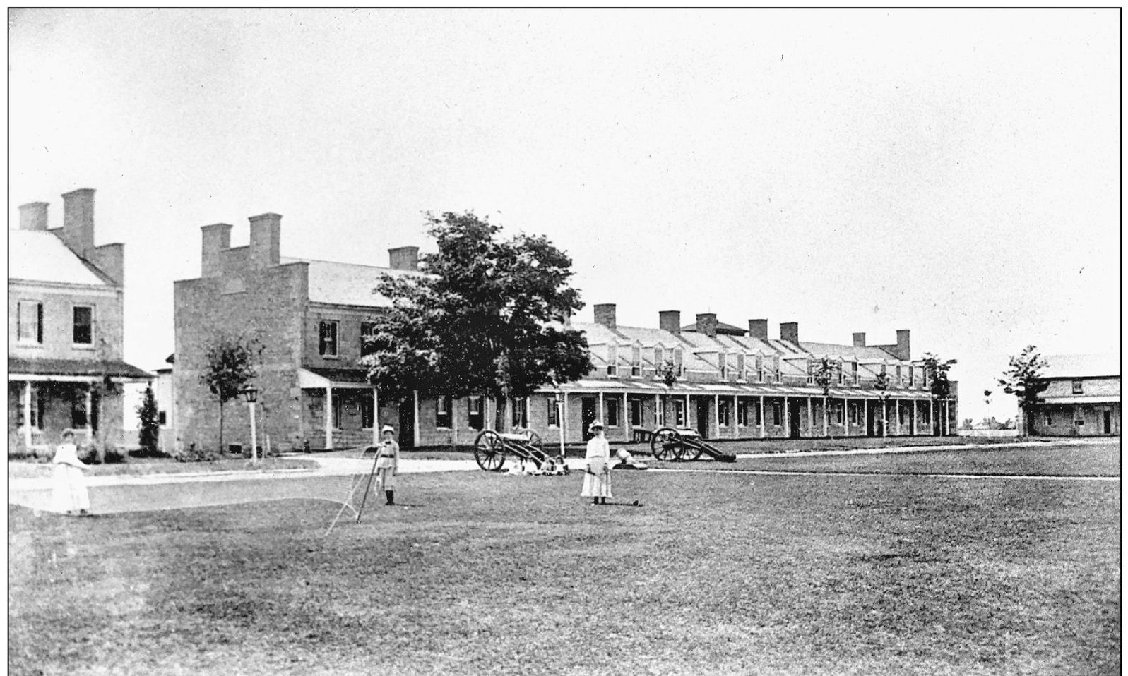 On a summer day officers wives enjoy a game of lawn tennis in front of the - photo 9