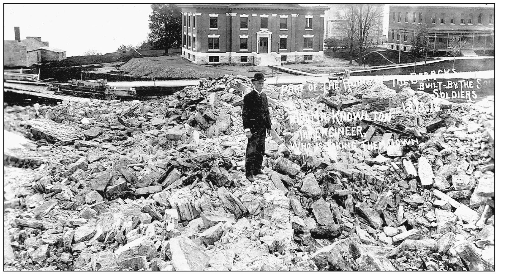 Post engineer Edwin C Knowlton stands on the rubble of the east wing of the - photo 12