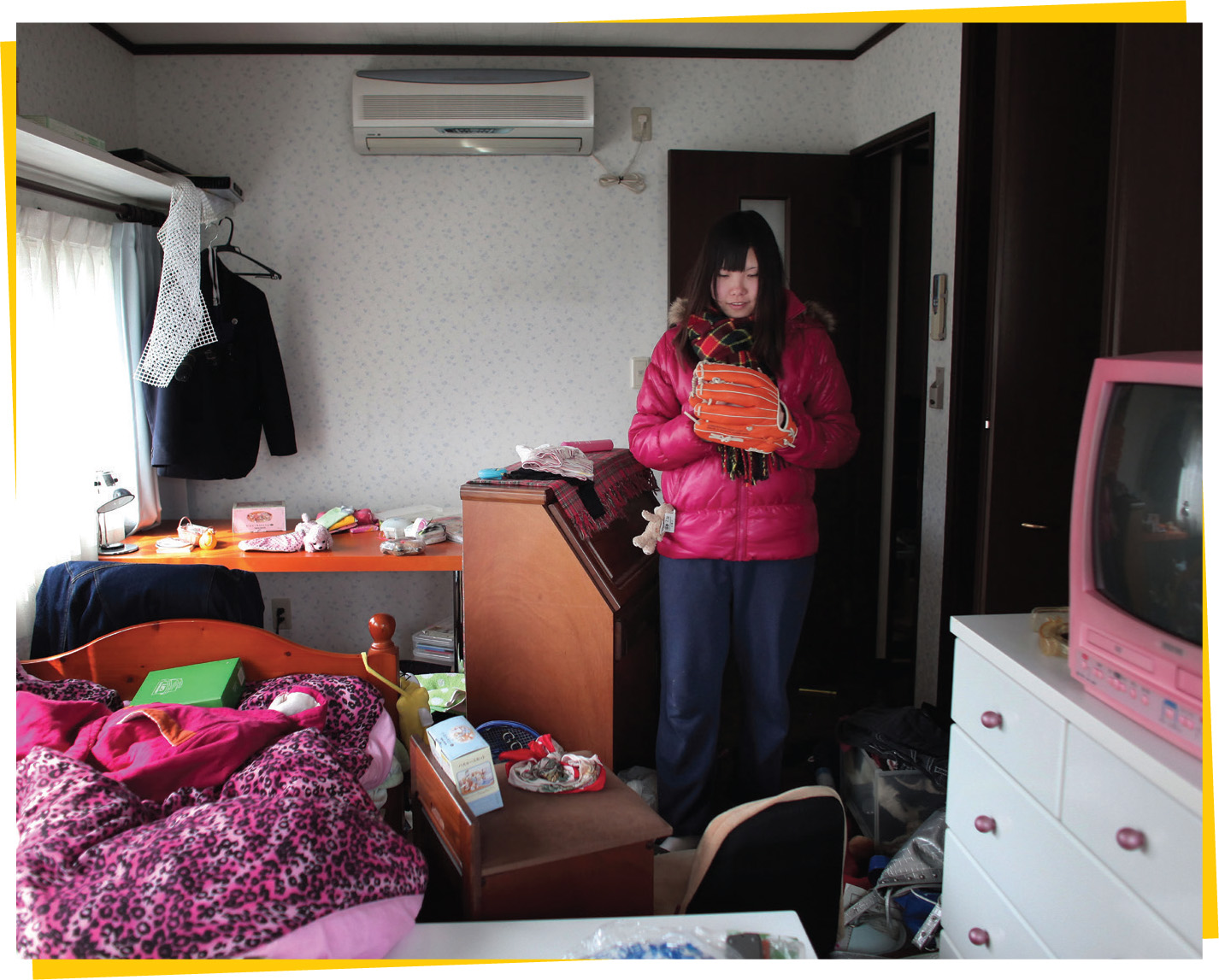 Murakami Misato surveys the damage done to her bedroom on the fourth floor of - photo 3