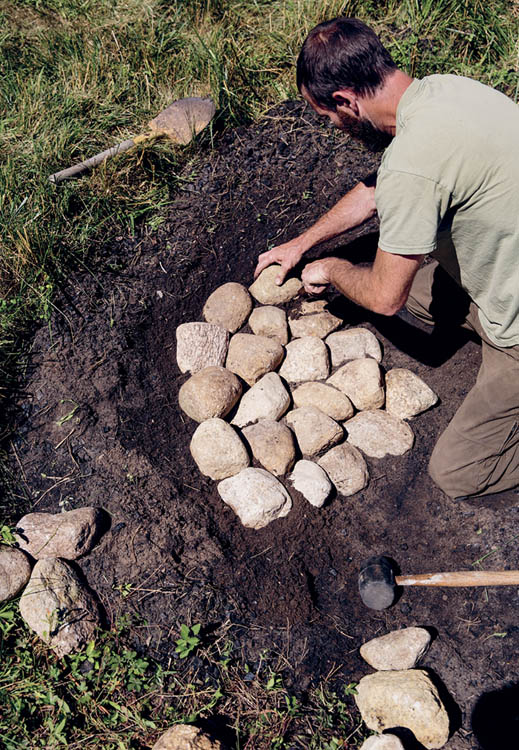 Line the pit with stone starting from the center and working outward in a - photo 8