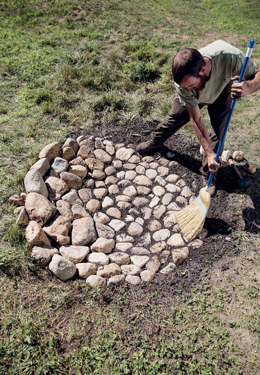 Sprinkle sand or light soil over the whole thing and use a small broom or hand - photo 9