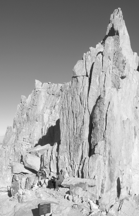 Enjoying a breather and snack beside pinnacles at Trail Crest The Whitney - photo 5