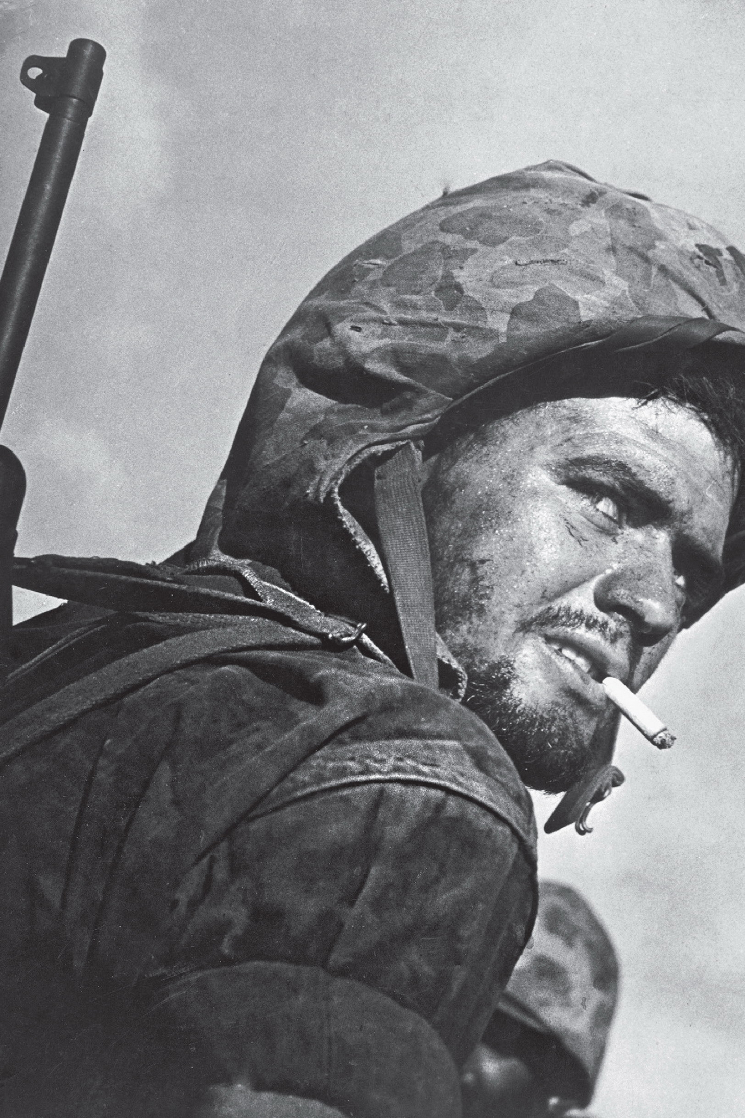 A battle-weary GI smokes a cigarette during the invasion of Saipan in 1944 - photo 3