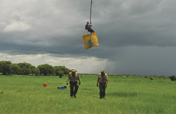 Willow heading back to camp on the sling after a days work collecting croc eggs - photo 1