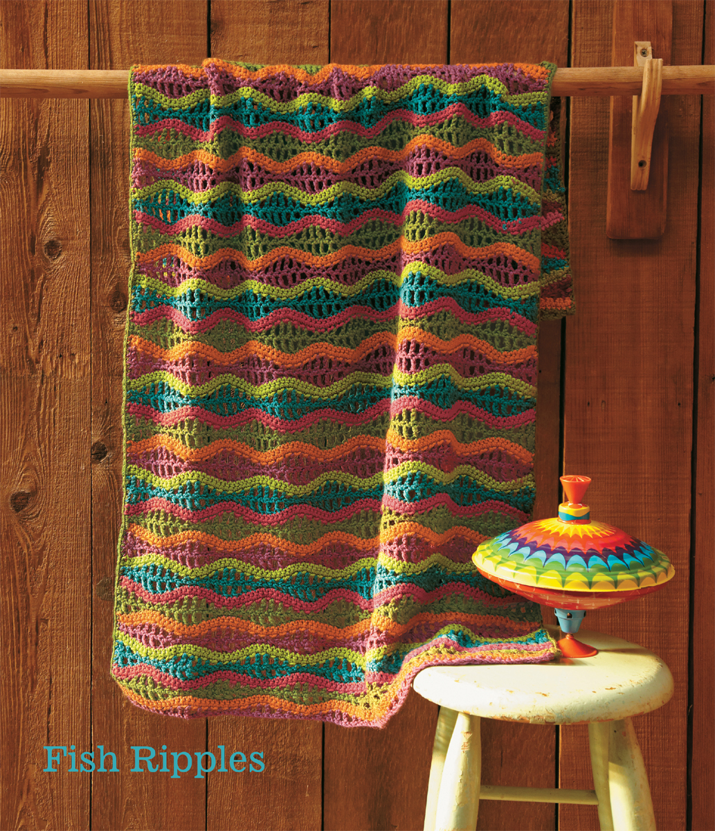 The colorful undulations of this crocheted baby blanket are reminiscent of - photo 4
