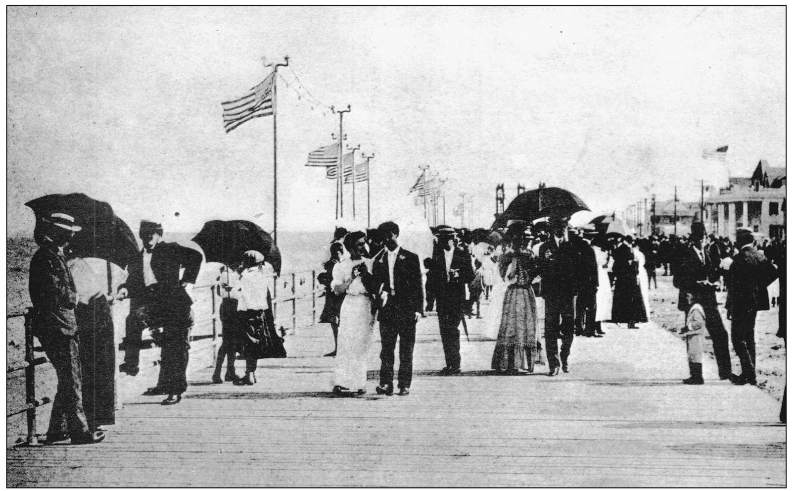 Couples are seen taking a walk along the wooden boardwalk They are headed - photo 10