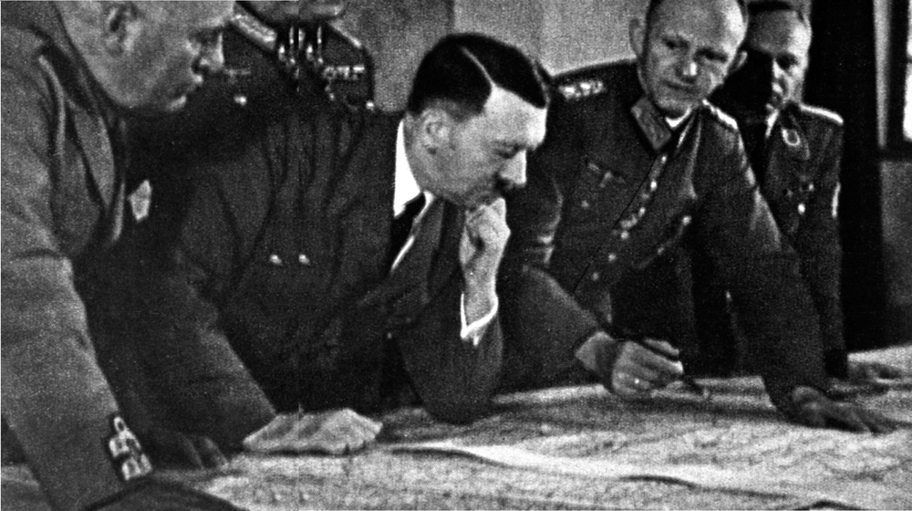 Hitler studying a map with his Staff whom he treated more as underlings than - photo 6