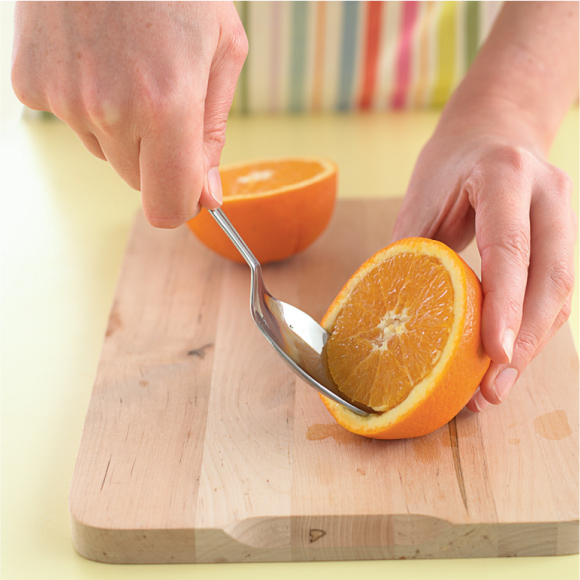 Cut the oranges in half using a sharp knife be careful of little fingers - photo 14