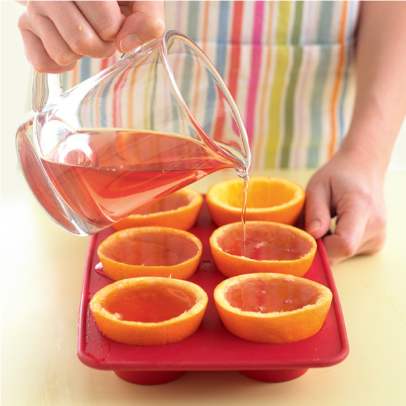 Put the empty orange halves into a muffin tin to keep them steady Then pour - photo 15