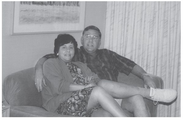 Jeannie and Brian Legg sitting in a loveseat similar to how their killer - photo 2