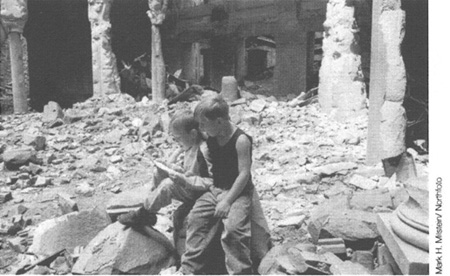 Two boys rummage through the remains of the Bosnian state library destroyed by - photo 6