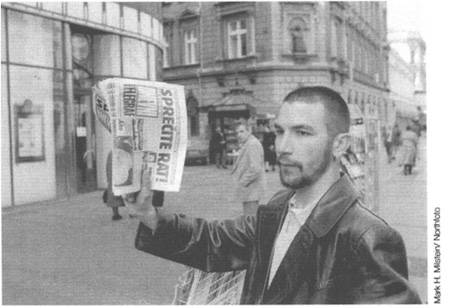 Belgrade March 1999 A newspaper seller in downtown Belgrade hawks copies of - photo 10