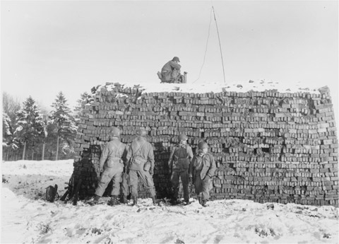 Pathfinders of the 101st Airborne set up their equipment on a pile of bricks on - photo 13