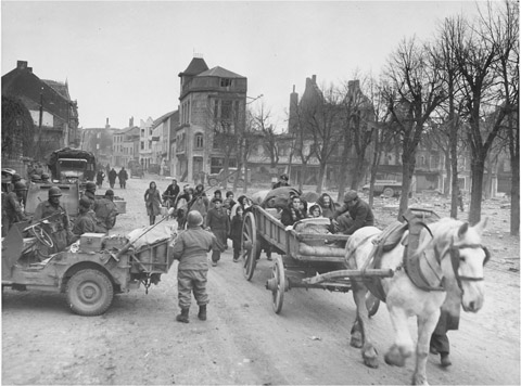 Belgian civilians stream out of Bastogne with few belongings The photo appears - photo 17