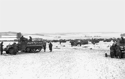 Troops and vehicles of Kilburns 11th Armored Division mass southwest of - photo 22