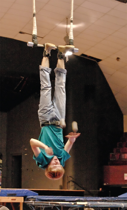 The longest duration juggling three objects while suspended upside down is 12 - photo 13