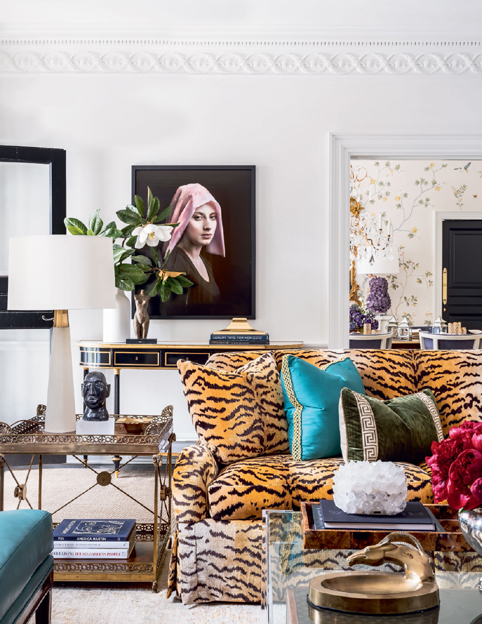 In an Atlanta living room by Melanie Turner a sofa covered in tiger-stripe - photo 33