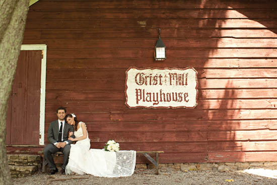 A country chic bride and groom take a moments rest at their outdoor wedding - photo 2