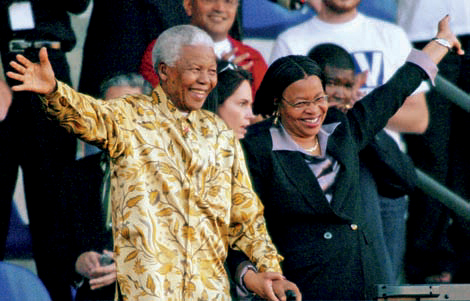 Mandela and his wife Graa Machel wave to crowds at the 46664 AIDS benefit - photo 1