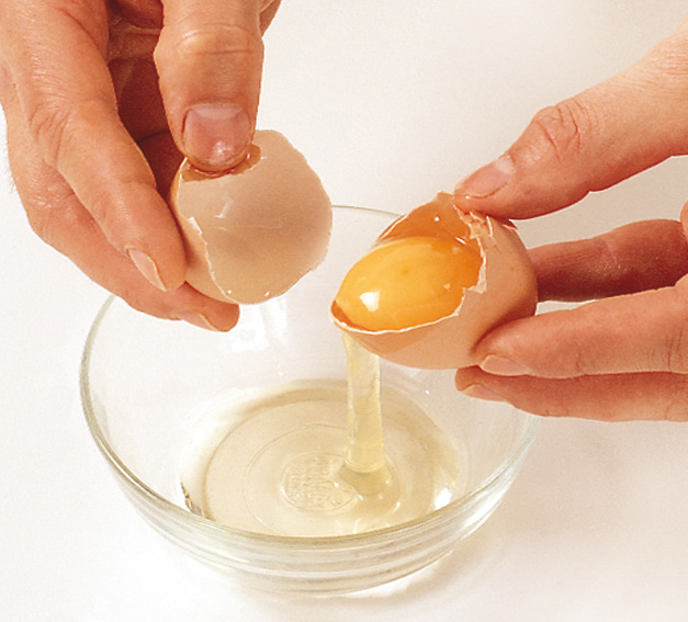 Holding an egg over a bowl break open the shell Carefully transfer the yolk - photo 6