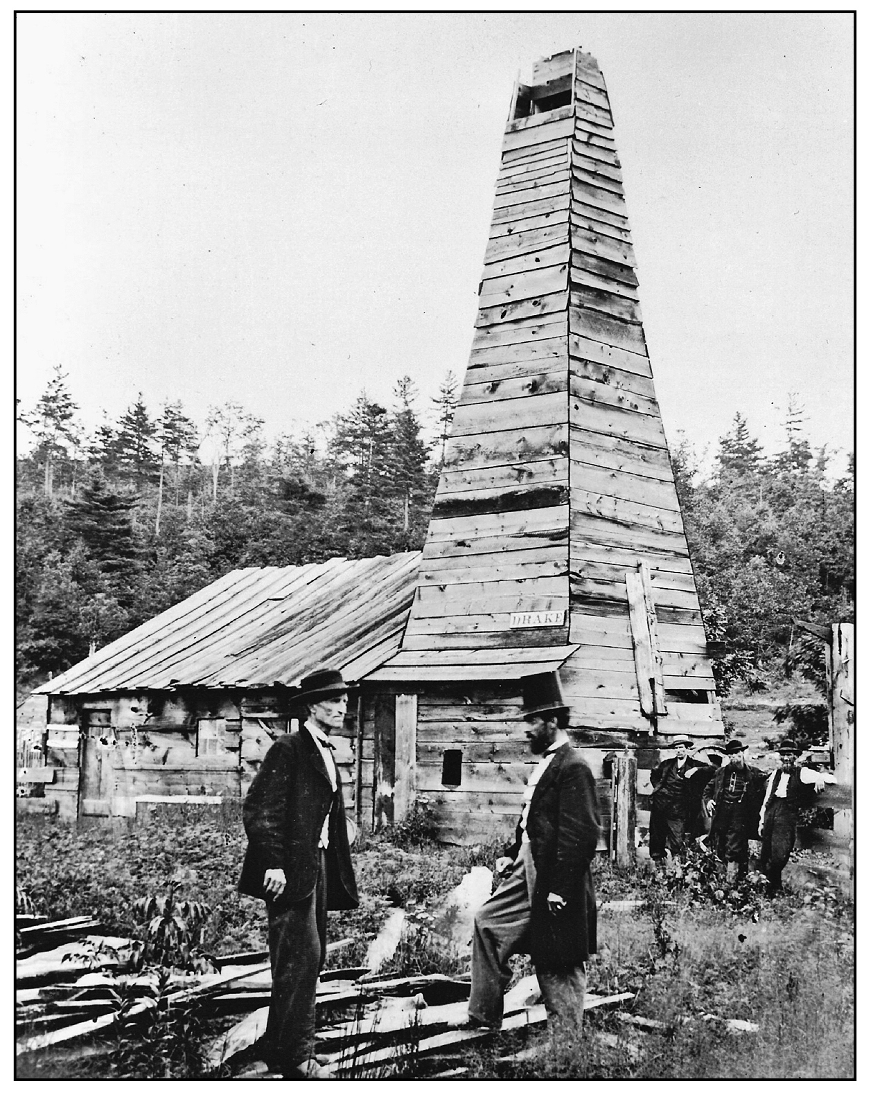 Edwin Drake in top hat and an unidentified man with Drakes famous well in the - photo 4