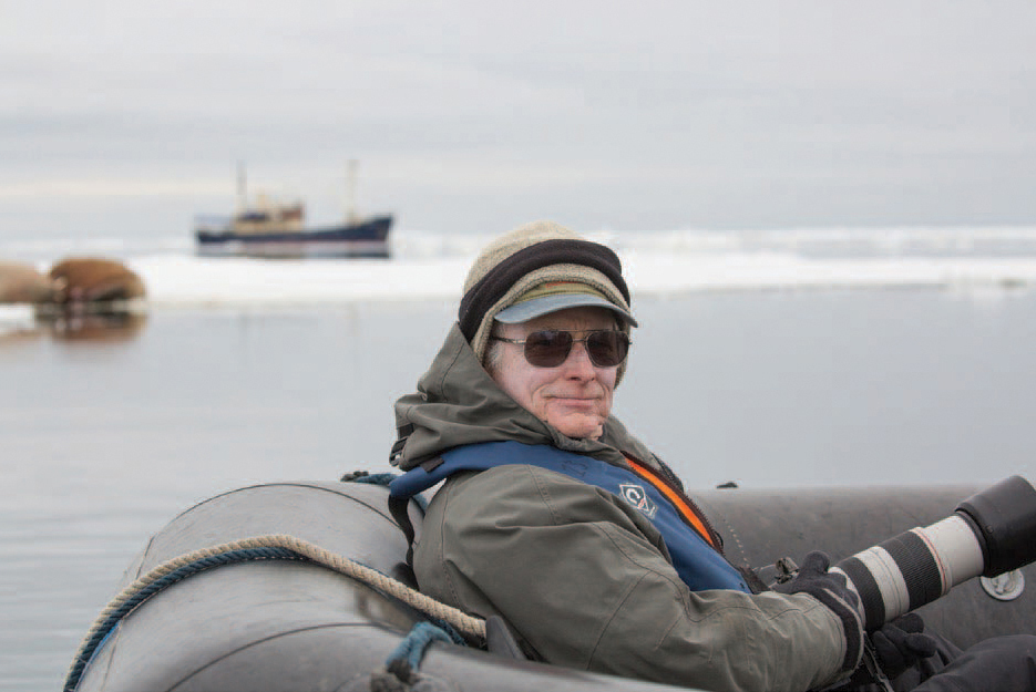 The author Joe McDonald on a Zodiac in Svalbard patiently waiting for some - photo 5