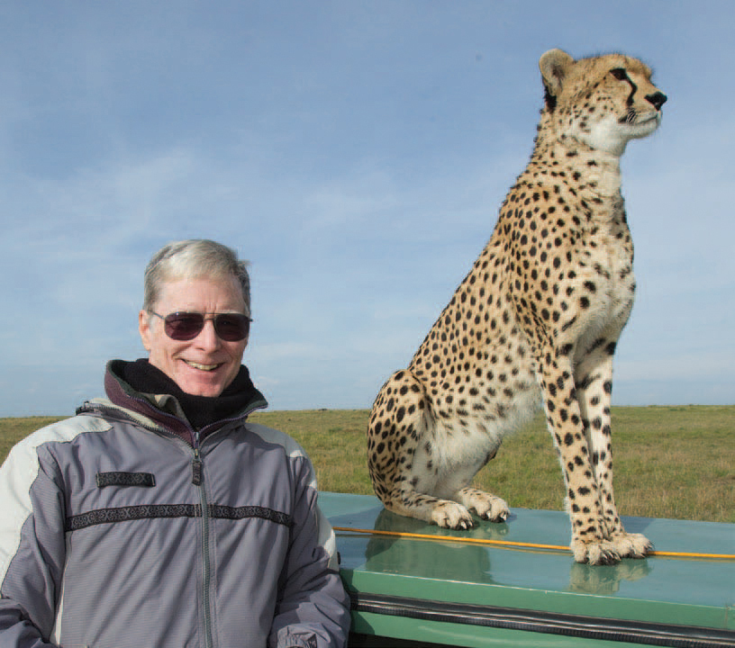 Joe McDonald with a wild Cheetah that frequently scouted for game from the - photo 8