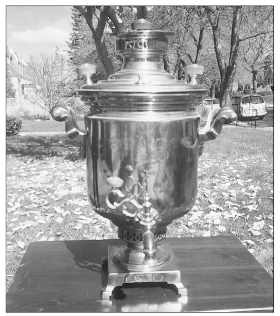 The samovar a vessel surrounding a charcoal hearth to heat hot water became a - photo 4