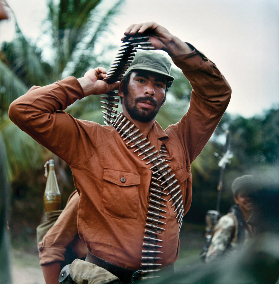 5 am A teenaged Sandinista fighter prepares for the days combat on the - photo 3