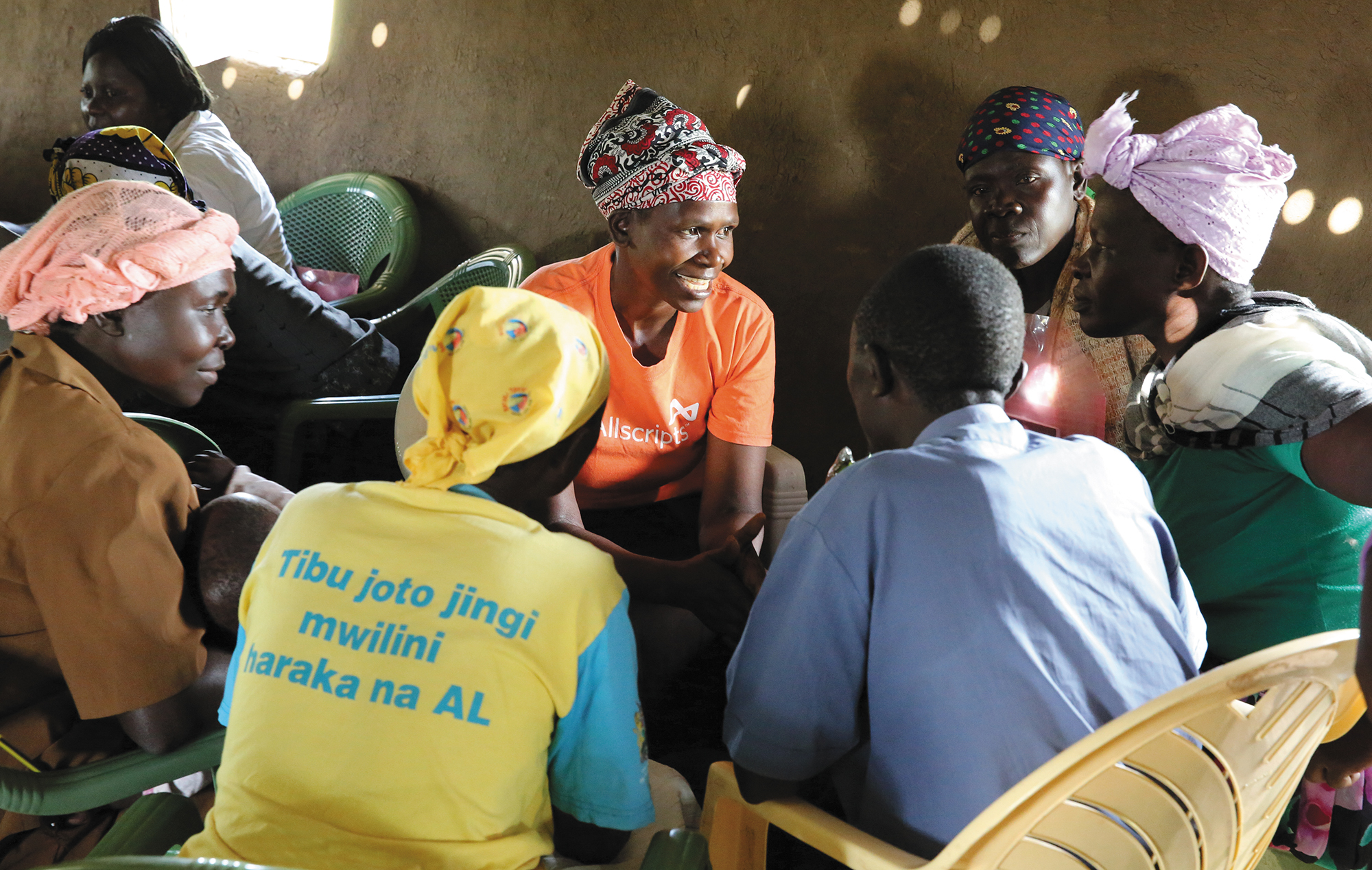 Leah facilitating a WASH training Elizabeth inspecting a family latrine - photo 15