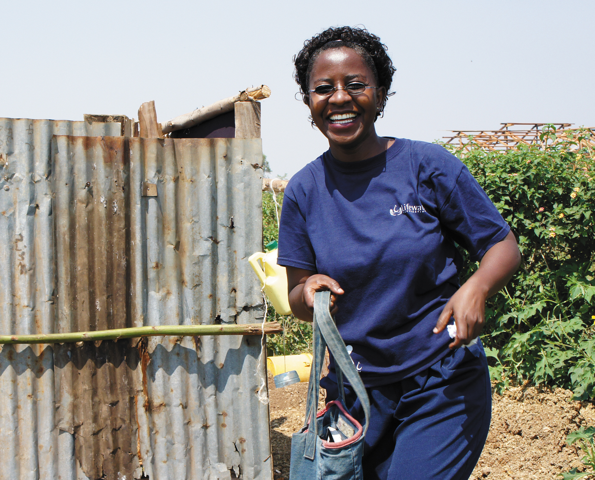 Elizabeth inspecting a family latrine Participating in a community WASH - photo 16