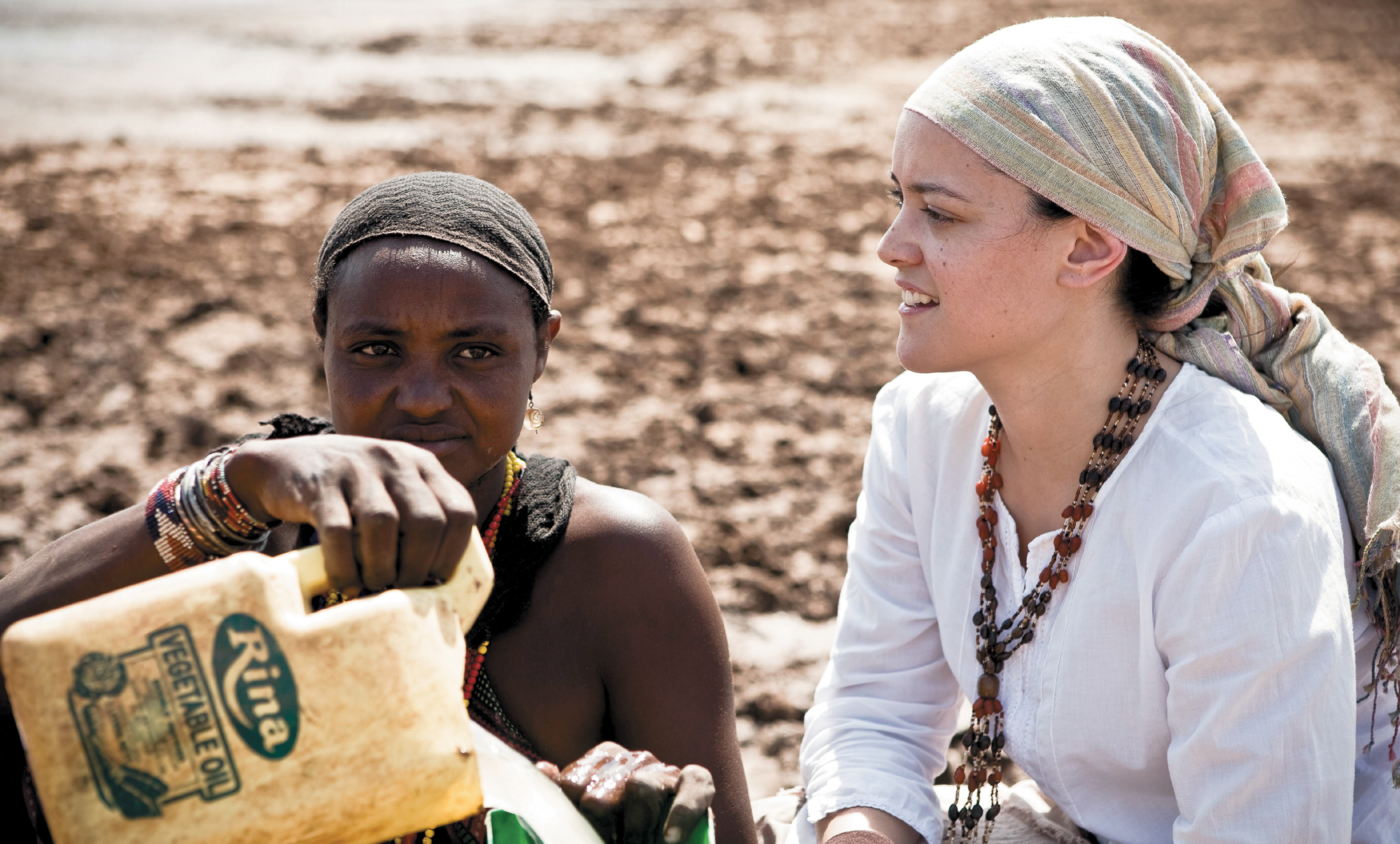 Jena and a community member near a limited water source in Marsabit James - photo 27