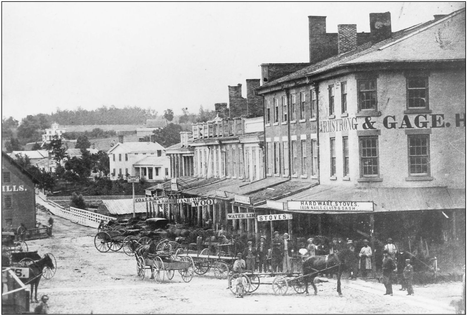 The west side of Main Street in 1868 had wooden sidewalks and awnings The - photo 5