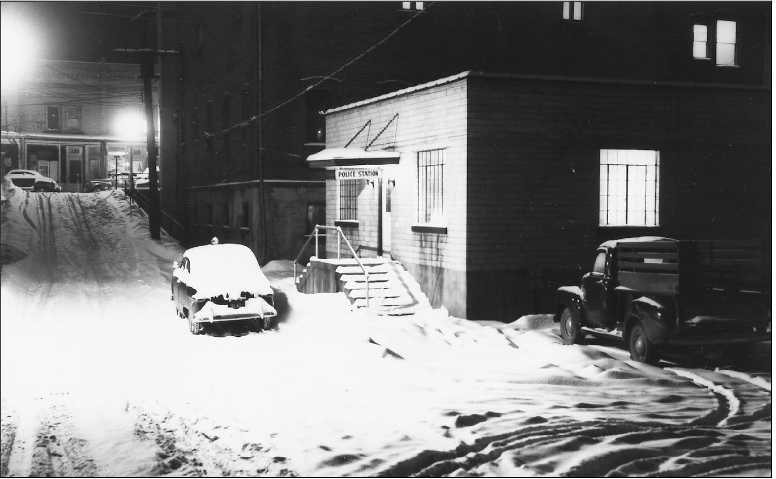 This 1950s photograph depicts the police station on Basin Street and the - photo 13