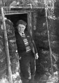 Mochulsky stands in front of the mud hut the prisoners built for him He wears - photo 14