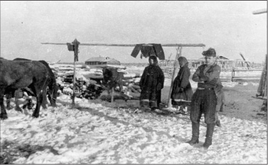 The author right stands at a temporary encampment in a Komi village as the - photo 7