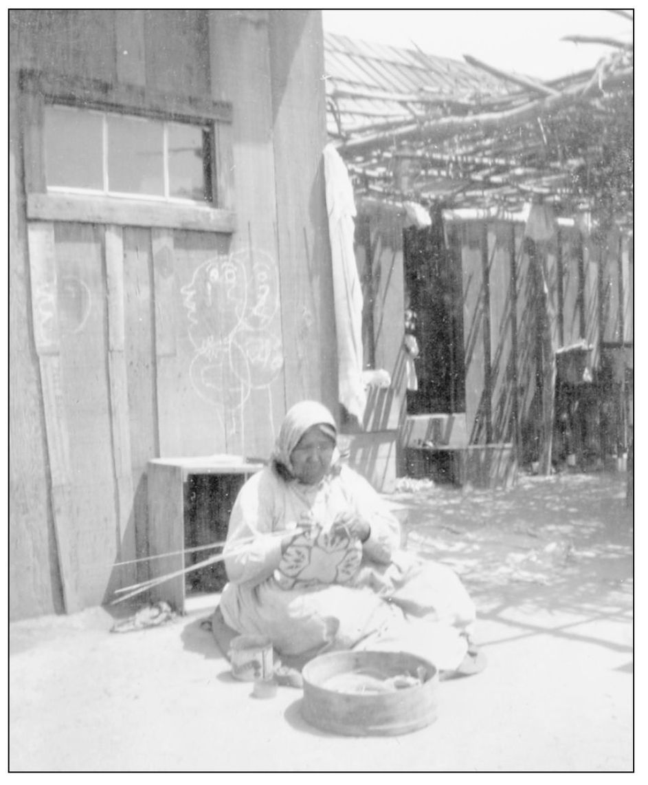 DOLORES CRISPIN MANUEL Dolores Crispin Manuel is seen here weaving a basket at - photo 10