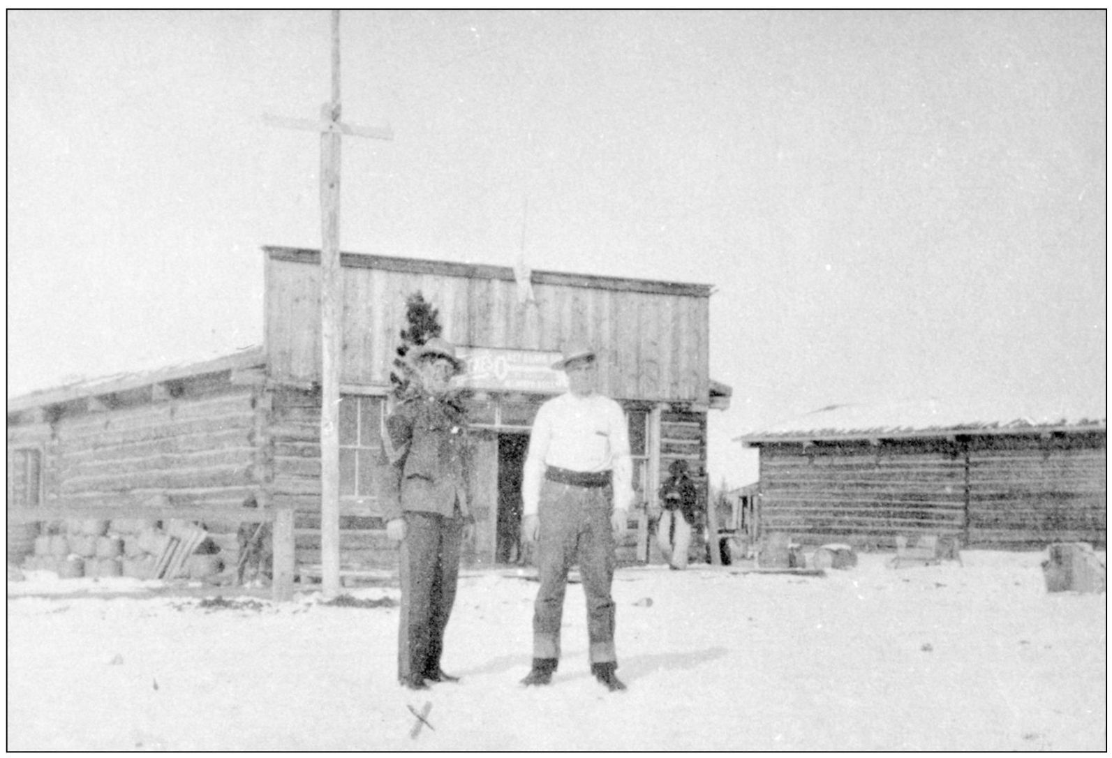 Boots Williams stands on the left next to an unidentified man in front of - photo 7