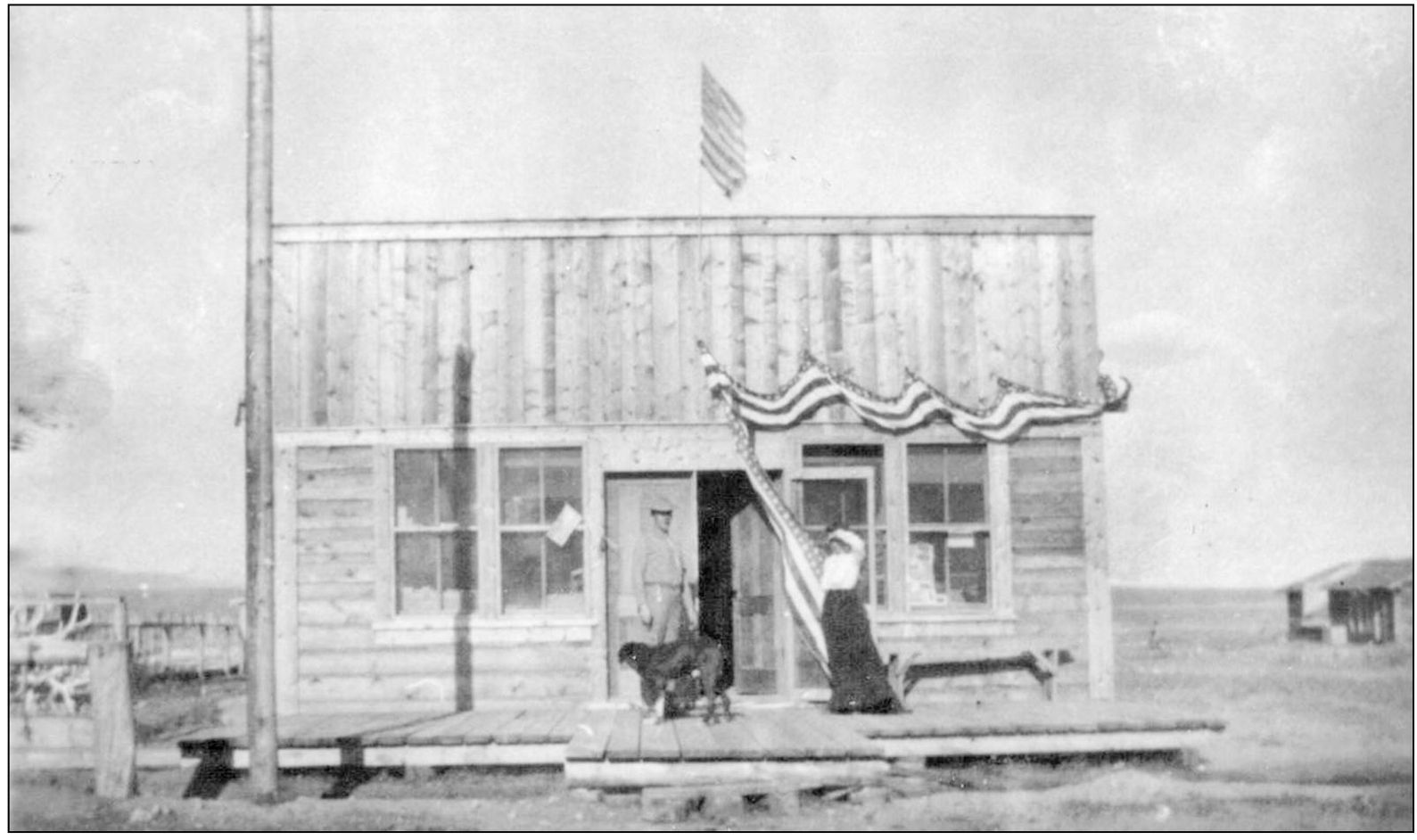 C Watt and Mayme Brandon stand in front of their Pinedale Roundup Building on - photo 8