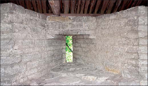 Interior view of a wall and a loophole of the boevoy hod wall-walk in the - photo 8