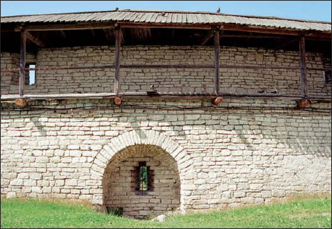 Interior view of a wall and a loophole of the boevoy hod wall-walk in the - photo 9