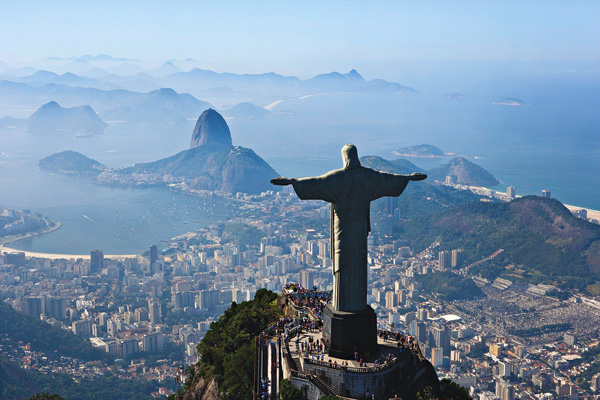 Christ the Redeemer overlooking Rio de Janeiro Brazil A man climbs the - photo 4