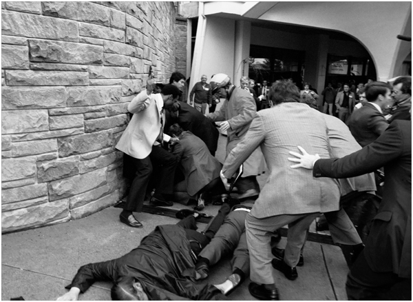 Secret Service agents surround John Hinckley following his attempt to - photo 10