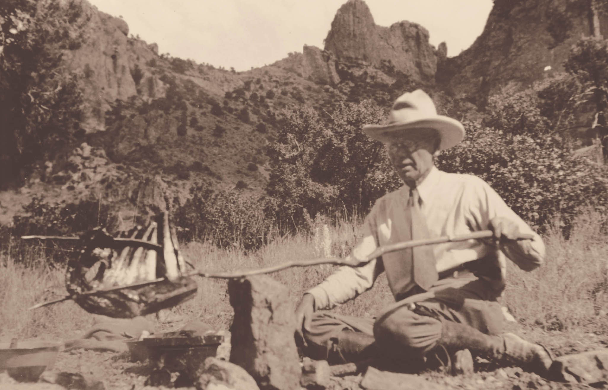 Captain Will Wright of the Texas Rangers cooks his dinner over a campfire - photo 2