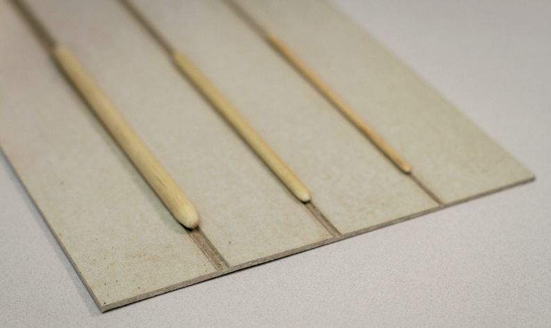 A board with narrow channels cut in it can be used to crease thick paper card - photo 6