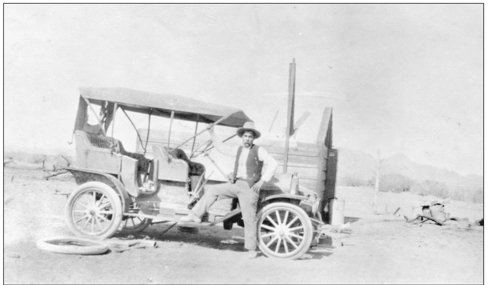 Standing next to a 1916 Ford is an unidentified man Neipps Meat Market - photo 17