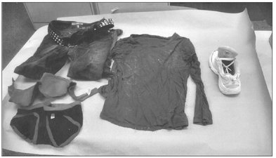 The unknown females clothing was displayed for the media to help identify the - photo 6