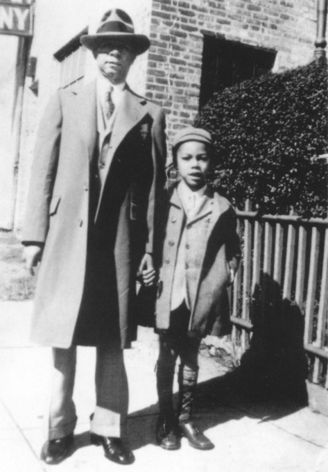 Luther Powell a snappy dresser with his well-togged big-footed son Colin - photo 6