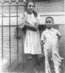 Hanging out with my sister Marilyn in front of our first apartment house in - photo 9