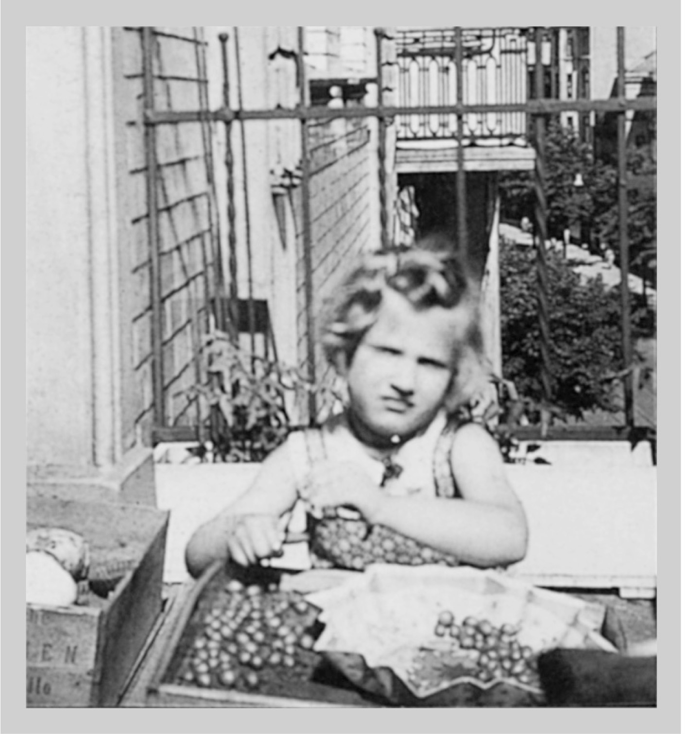 Barbie aged 4 topping and tailing gooseberries on the balcony of their - photo 5